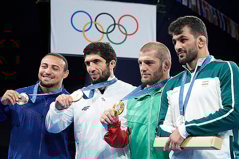 Paris Olympics men's freestyle 86kg wrestling: Aaron Marquel Brooks, of the United State, Greece's Dauren Kurugliev, bronze, Bulgaria's Magomed Ramazanov, gold, Iran's Hassan Yazdanicharati, silver